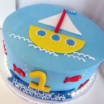 Round ocean and sailing theme birthday cake for one-year-old